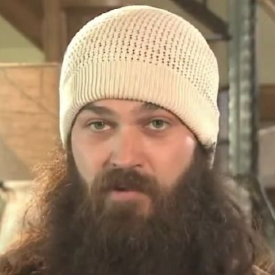 Jep Robertson can be seen rocking his long beard and also wearing a white cap in the picture.